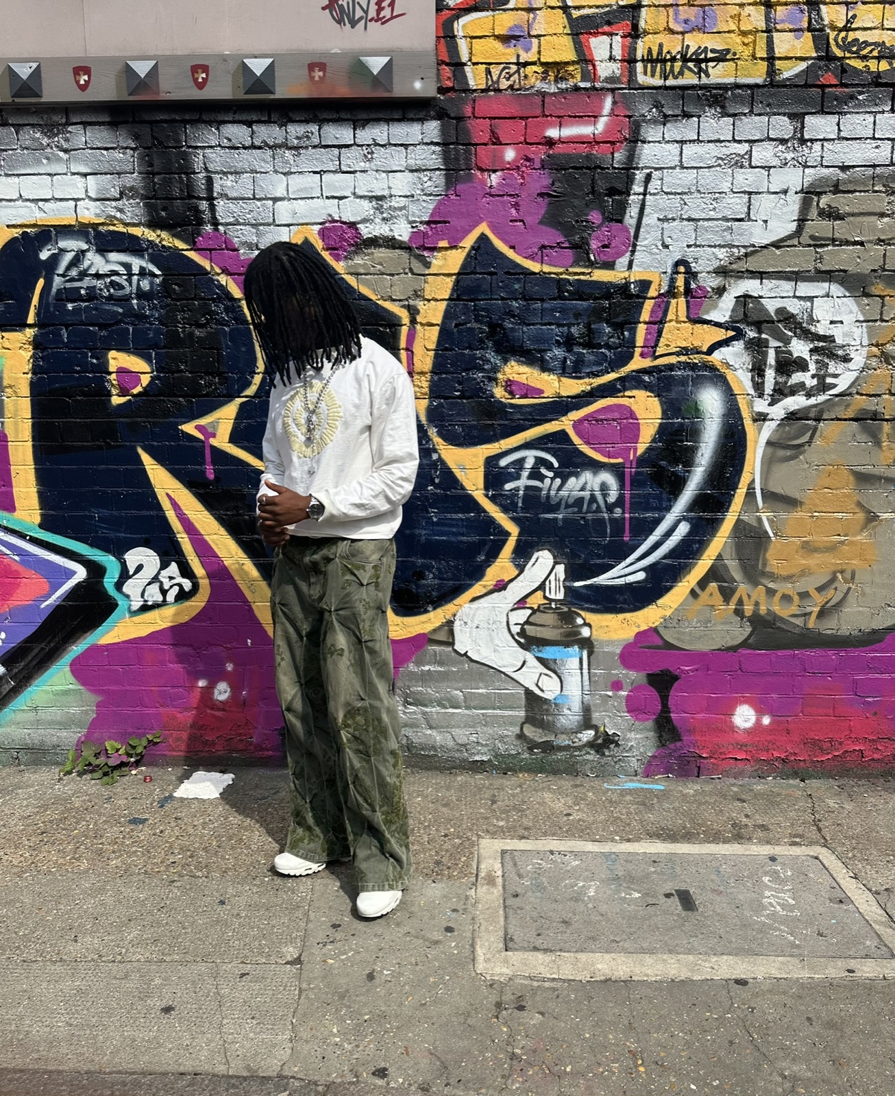 White hoodie, graffiti wall