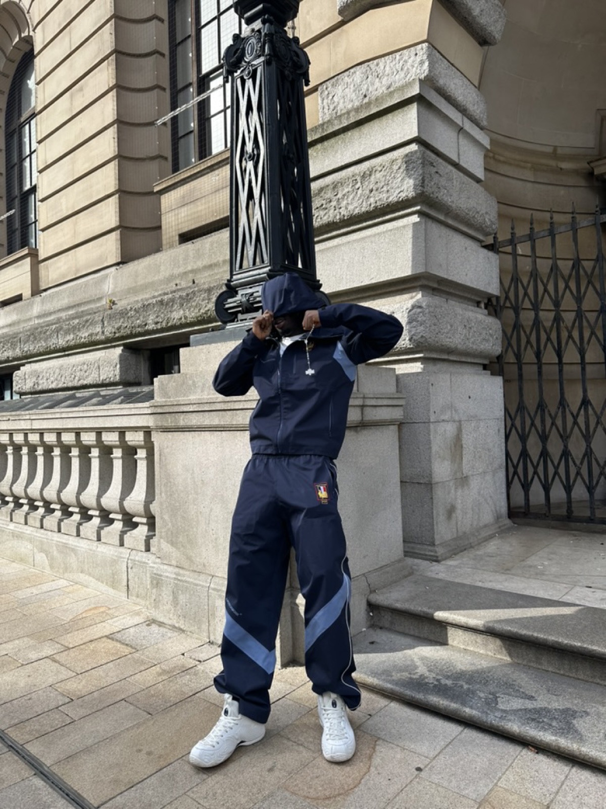 Wesh, navy tracksuit at the lamppost